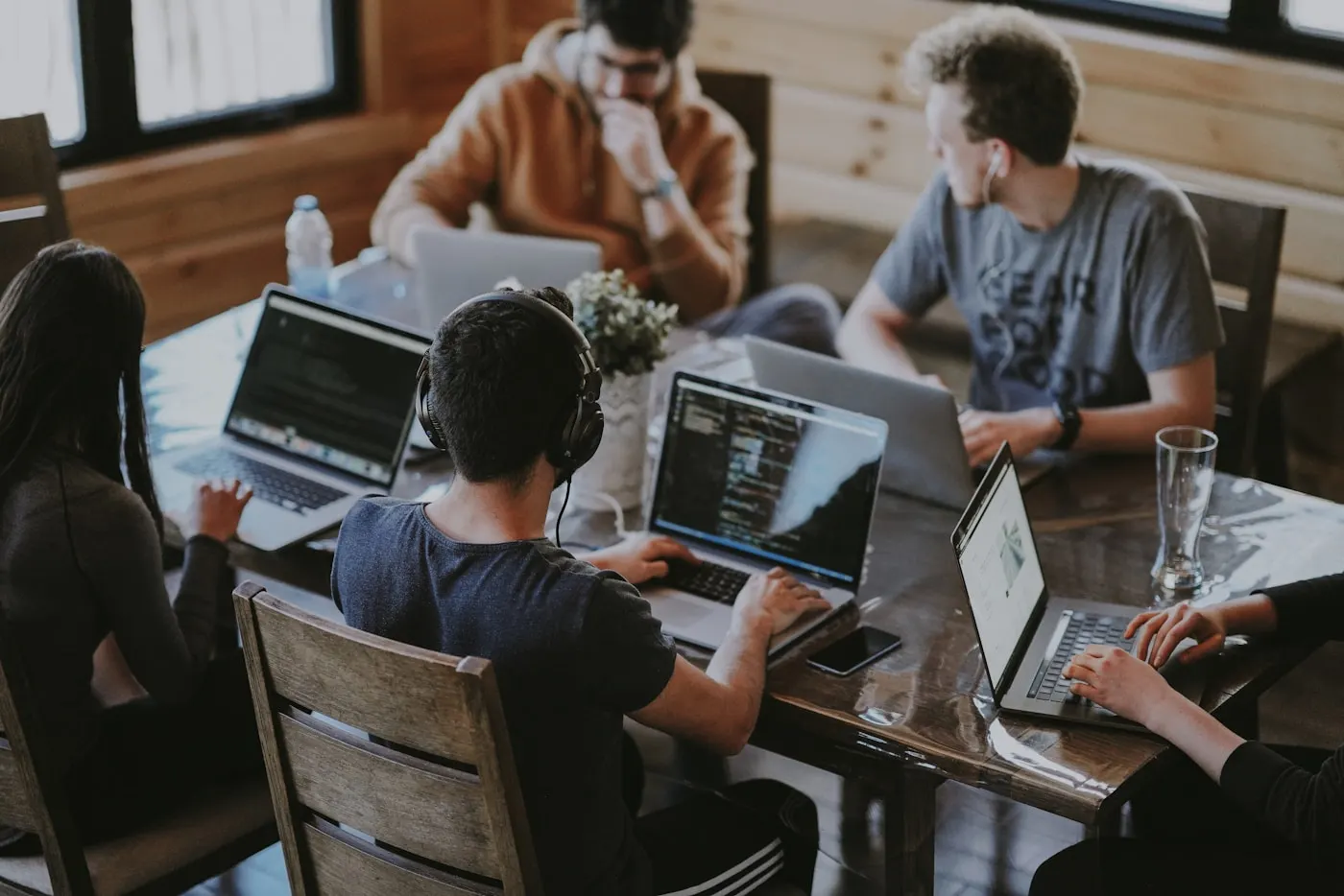 Private equity professionals in a boardroom discussion